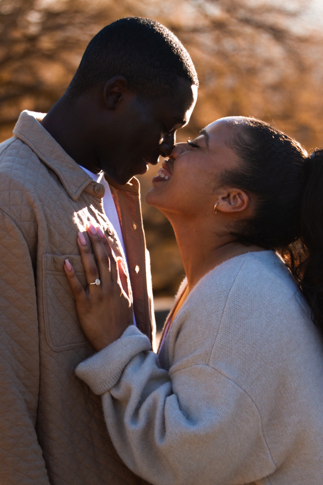 A couple kissing after a proposal