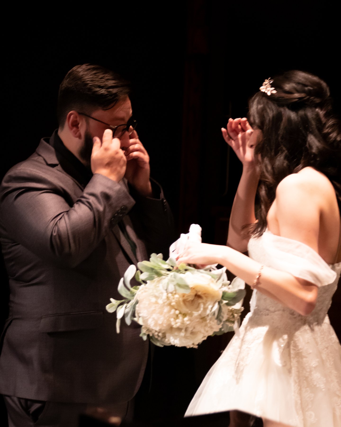 Jackie and Julian wiping away tears during their first look