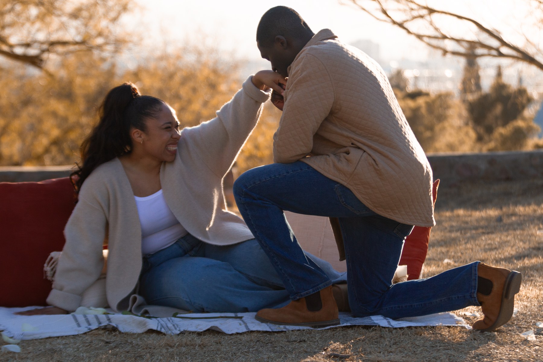 A quiet moment together beside a picnic setup